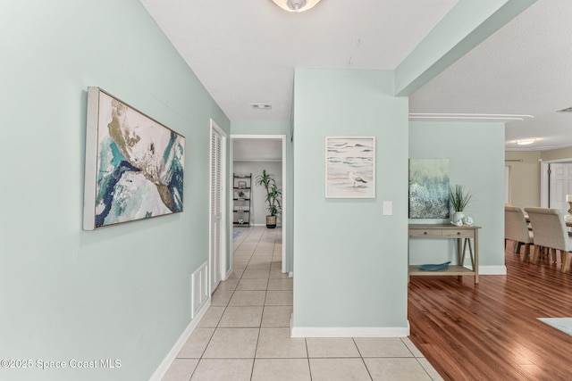 1675 Vega Ave, Merritt Island, FL 32953 - hall with light tile patterned floors and baseboards