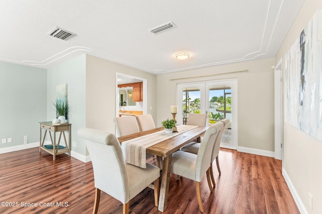 1675 Vega Ave, Merritt Island, FL 32953 - dining room featuring wood finished floors and baseboards