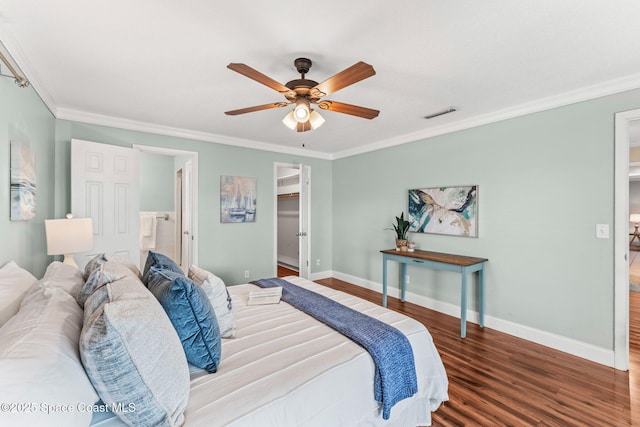 1675 Vega Ave, Merritt Island, FL 32953 - bedroom with wood finished floors, ornamental molding, baseboards, a walk in closet, and a ceiling fan