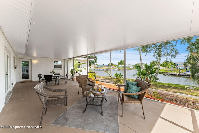 1675 Vega Ave, Merritt Island, FL 32953 - sunroom with a water view, concrete flooring, and outdoor dining area