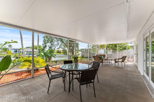 1675 Vega Ave, Merritt Island, FL 32953 - sunroom featuring an outdoor hangout area, healthy amount of natural light, a water view, and outdoor dining space
