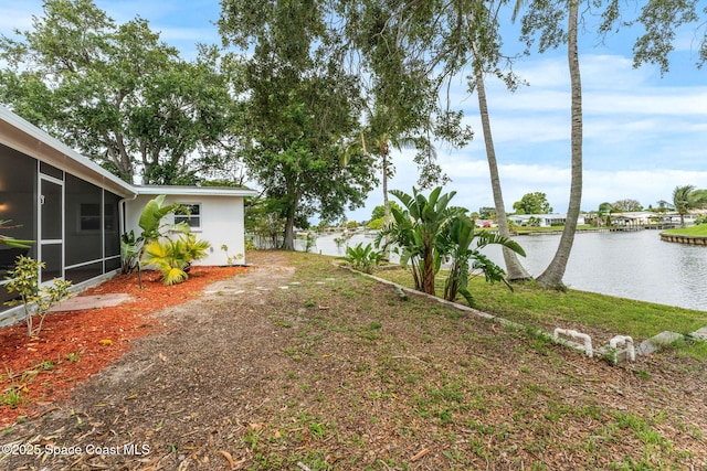 1675 Vega Ave, Merritt Island, FL 32953 - view of yard with a water view and a sunroom