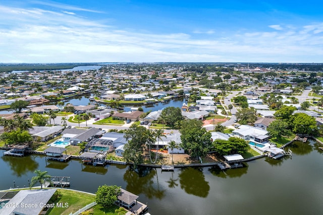 1675 Vega Ave, Merritt Island, FL 32953 - aerial view of property and surrounding area with nearby suburban area and a large body of water
