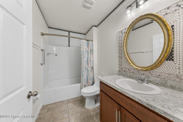 bathroom featuring vanity, toilet, shower / bath combo, and tile patterned flooring