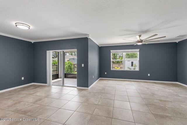 unfurnished room with a textured ceiling, ceiling fan, crown molding, tile patterned flooring, and baseboards