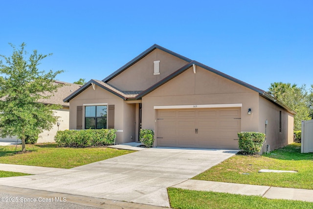 369 Coyote Dr, Cocoa, FL 32927 - view of front of house with an attached garage, a front lawn, concrete driveway, and stucco siding