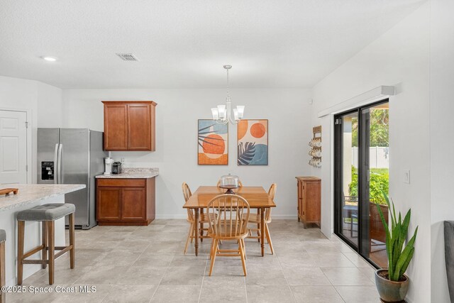 369 Coyote Dr, Cocoa, FL 32927 - dining room with a chandelier and baseboards