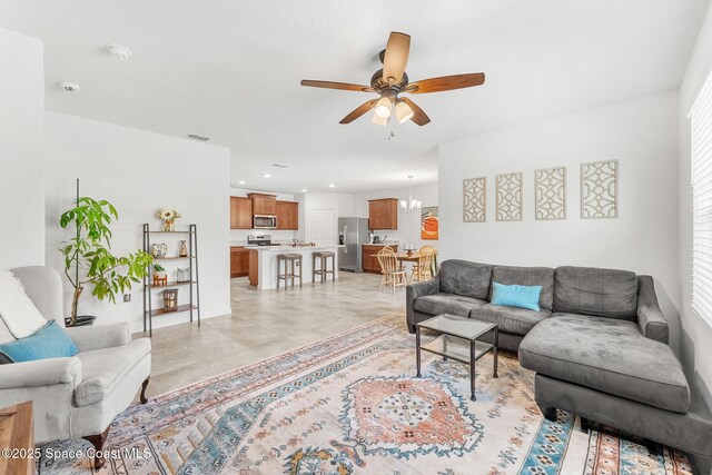 369 Coyote Dr, Cocoa, FL 32927 - living room with a ceiling fan, light tile patterned floors, and recessed lighting