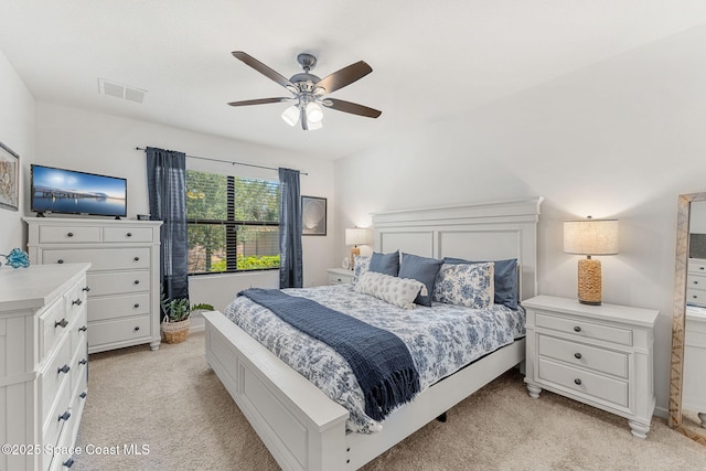 369 Coyote Dr, Cocoa, FL 32927 - bedroom with light carpet and ceiling fan
