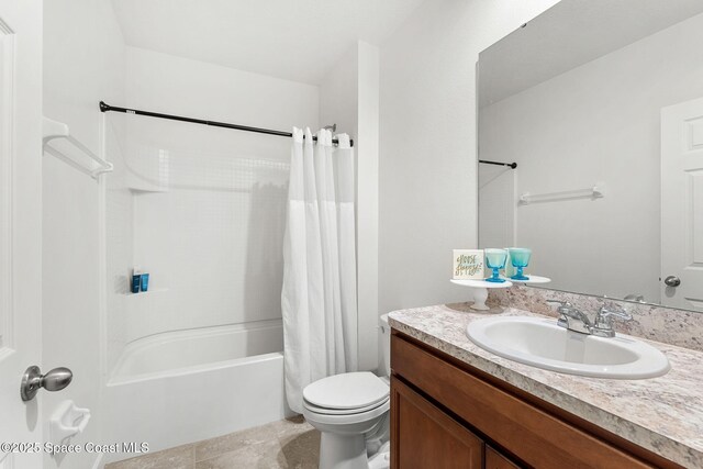 369 Coyote Dr, Cocoa, FL 32927 - bathroom with toilet, shower / bath combo with shower curtain, and vanity