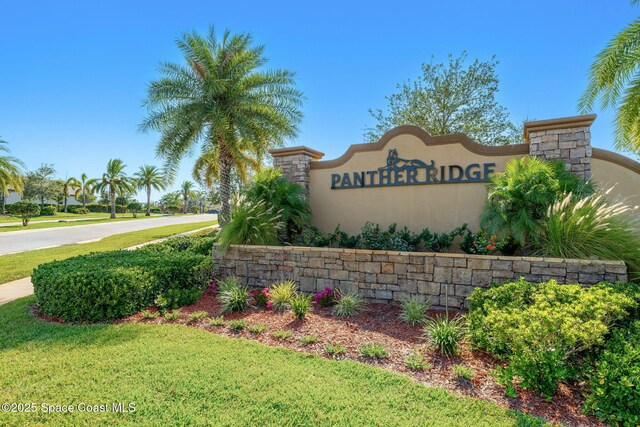 369 Coyote Dr, Cocoa, FL 32927 - community sign with a lawn