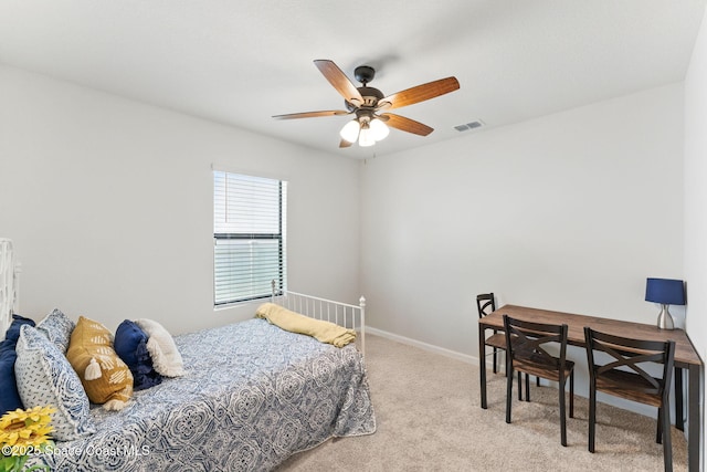 369 Coyote Dr, Cocoa, FL 32927 - carpeted bedroom with baseboards and ceiling fan