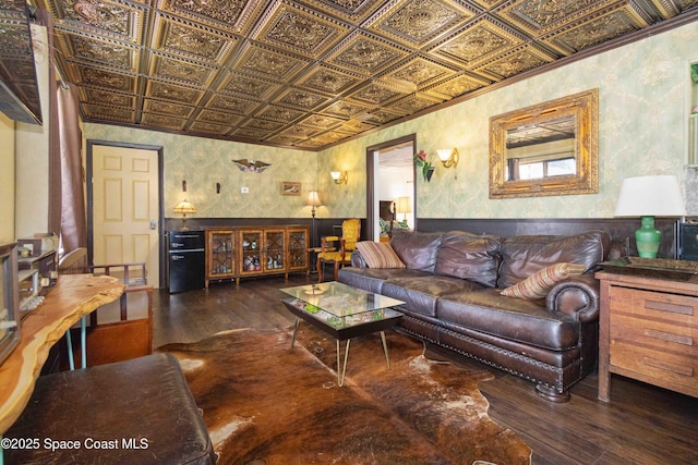 326 Pierce Ave, Cape Canaveral, FL 32920 - living room with an ornate ceiling, hardwood / wood-style flooring, a wainscoted wall, wallpapered walls, and crown molding