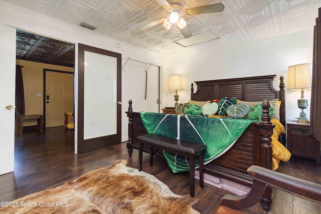 326 Pierce Ave, Cape Canaveral, FL 32920 - bedroom with an ornate ceiling, wood finished floors, and ceiling fan