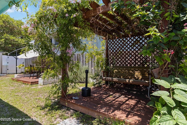 326 Pierce Ave, Cape Canaveral, FL 32920 - fenced backyard featuring a deck