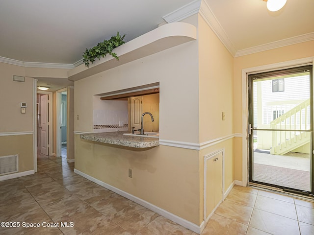 5720 Marina Dr Unit 2, Sebastian, FL 32958 - kitchen with crown molding, baseboards, a sink, and tile patterned floors