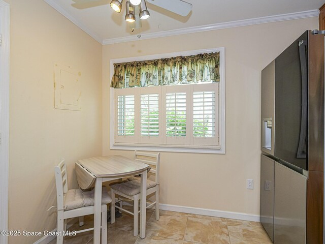 5720 Marina Dr Unit 2, Sebastian, FL 32958 - dining area featuring a ceiling fan, crown molding, and baseboards