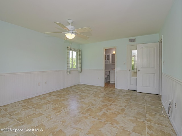 5720 Marina Dr Unit 2, Sebastian, FL 32958 - unfurnished room featuring a wainscoted wall and ceiling fan