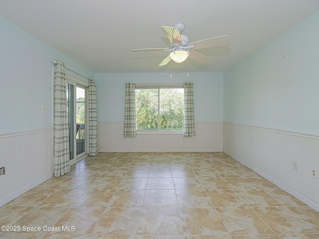 5720 Marina Dr Unit 2, Sebastian, FL 32958 - unfurnished room with a wainscoted wall and ceiling fan