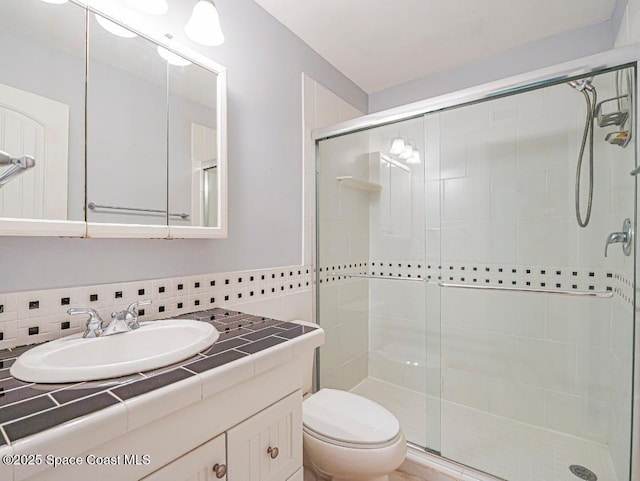 5720 Marina Dr Unit 2, Sebastian, FL 32958 - bathroom with a shower stall, toilet, and vanity
