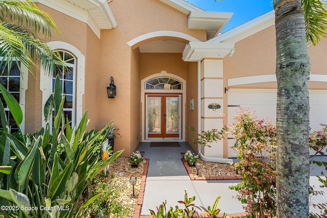 entrance to property with french doors and stucco siding