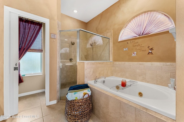 full bath featuring tile patterned floors, a stall shower, and a jetted tub
