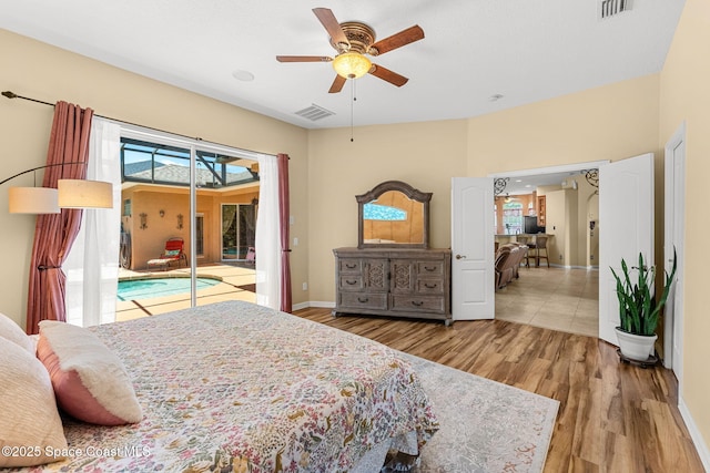 bedroom with access to outside, wood finished floors, baseboards, and ceiling fan