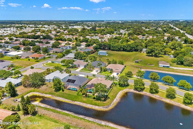 aerial view of residential area with a large body of water