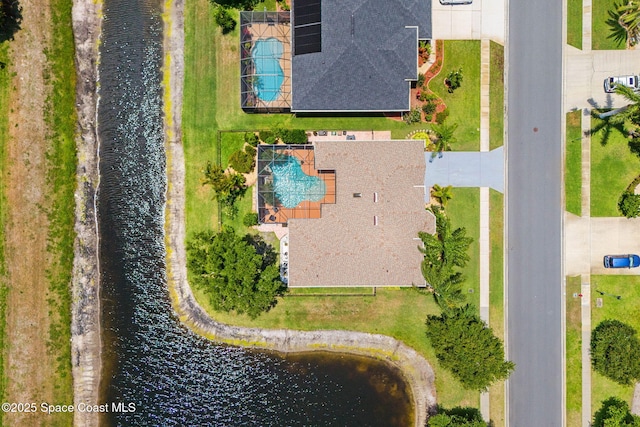 bird's eye view of a large body of water and a pool area