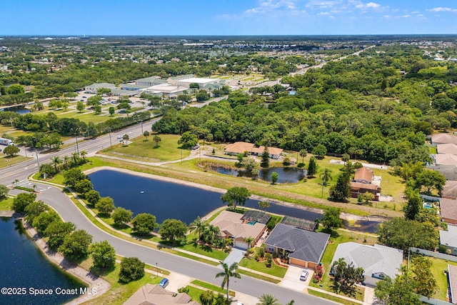 aerial view of residential area with a nearby body of water