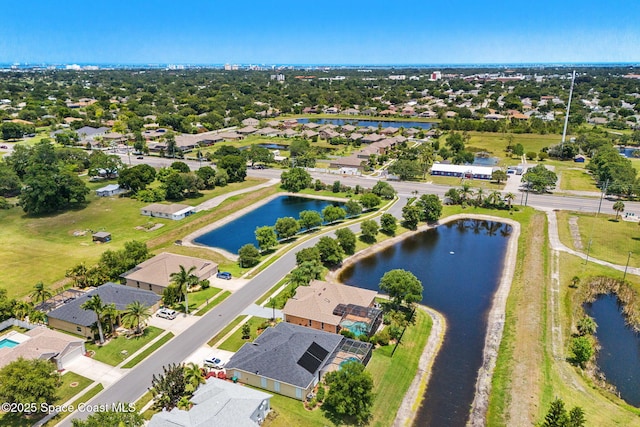aerial view of residential area with a large body of water