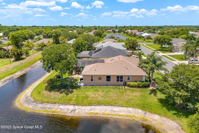 aerial view of residential area with a large body of water