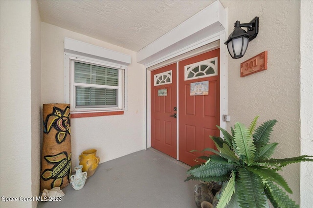 3360 S Atlantic Ave Unit 301, Cocoa Beach, FL 32931 - property entrance featuring stucco siding and covered porch