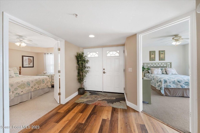 3360 S Atlantic Ave Unit 301, Cocoa Beach, FL 32931 - foyer entrance featuring baseboards, ceiling fan, wood finished floors, and carpet floors