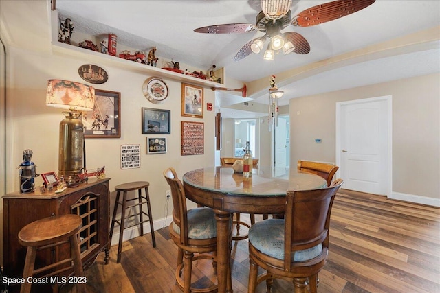 3360 S Atlantic Ave Unit 301, Cocoa Beach, FL 32931 - dining space featuring wood finished floors, baseboards, ceiling fan, and lofted ceiling
