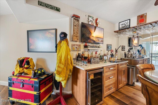 3360 S Atlantic Ave Unit 301, Cocoa Beach, FL 32931 - indoor dry bar featuring wine cooler, wood finished floors, and baseboards
