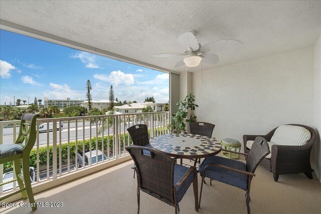 3360 S Atlantic Ave Unit 301, Cocoa Beach, FL 32931 - balcony featuring a ceiling fan
