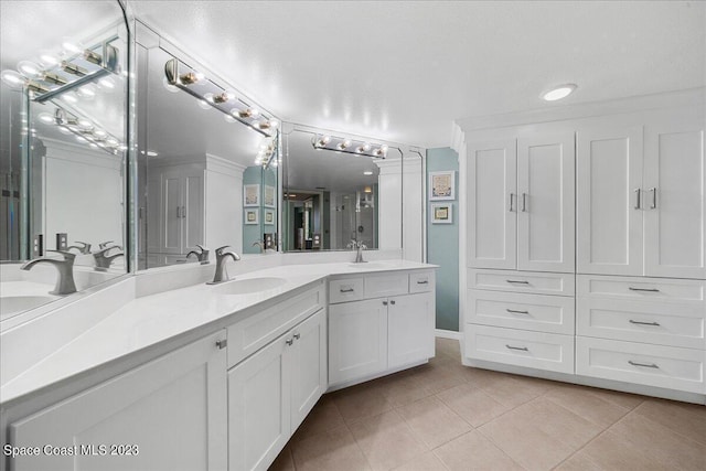 3360 S Atlantic Ave Unit 301, Cocoa Beach, FL 32931 - bathroom featuring tile patterned floors and vanity