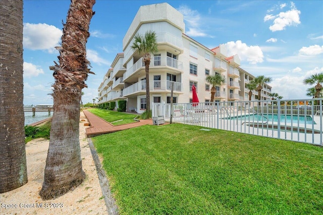 3360 S Atlantic Ave Unit 301, Cocoa Beach, FL 32931 - view of apartment building / complex featuring fence