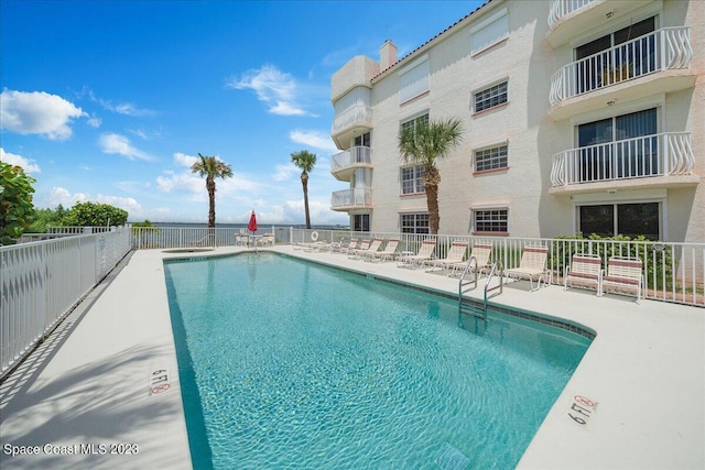 3360 S Atlantic Ave Unit 301, Cocoa Beach, FL 32931 - community pool with fence and a patio