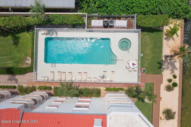3360 S Atlantic Ave Unit 301, Cocoa Beach, FL 32931 - drone / aerial view of a pool area