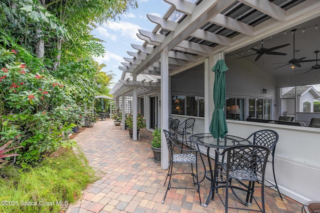 1863 Freedom Dr, Melbourne, FL 32940 - view of patio with a pergola, outdoor dining area, and a ceiling fan