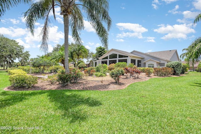 1863 Freedom Dr, Melbourne, FL 32940 - back of house featuring a lawn and stucco siding