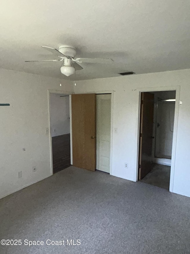 1602 University Ln Unit 1307, Cocoa, FL 32922 - unfurnished bedroom featuring ensuite bathroom and carpet