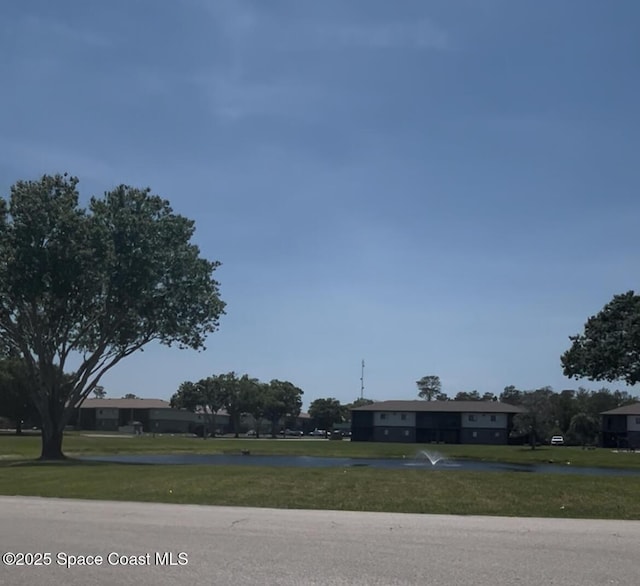 1602 University Ln Unit 1307, Cocoa, FL 32922 - view of asphalt road featuring a water view