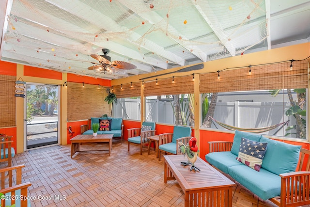 303 Winslow Cir, Cocoa Beach, FL 32931 - sunroom / solarium featuring an outdoor hangout area and a ceiling fan