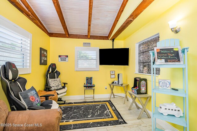 303 Winslow Cir, Cocoa Beach, FL 32931 - sitting room with wood finished floors, baseboards, and wood ceiling with exposed beams
