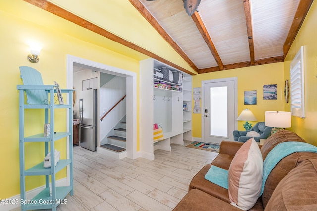 303 Winslow Cir, Cocoa Beach, FL 32931 - living area featuring stairs, wood finished floors, wooden ceiling, and baseboards