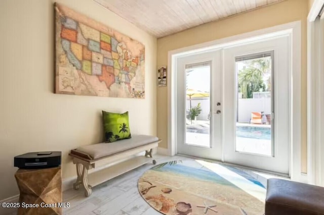 303 Winslow Cir, Cocoa Beach, FL 32931 - doorway with french doors and baseboards