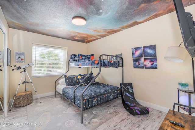 303 Winslow Cir, Cocoa Beach, FL 32931 - bedroom featuring baseboards